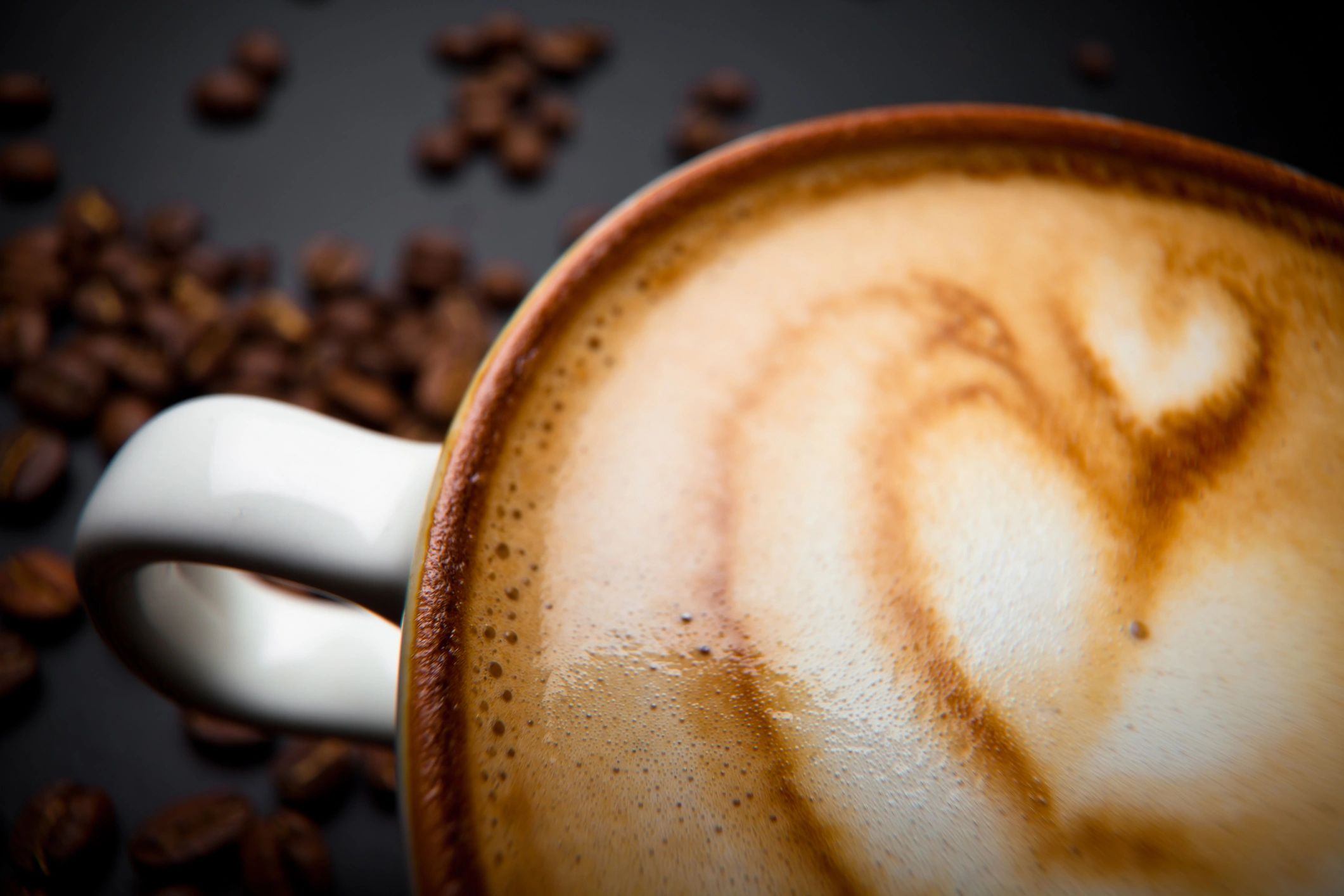 Cup of latte with heart-shaped art